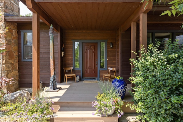 doorway to property with covered porch