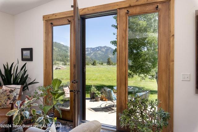 doorway to outside featuring a mountain view