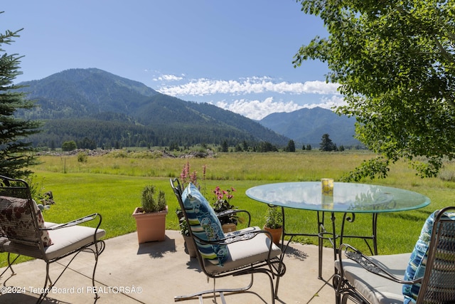 view of patio / terrace with a mountain view