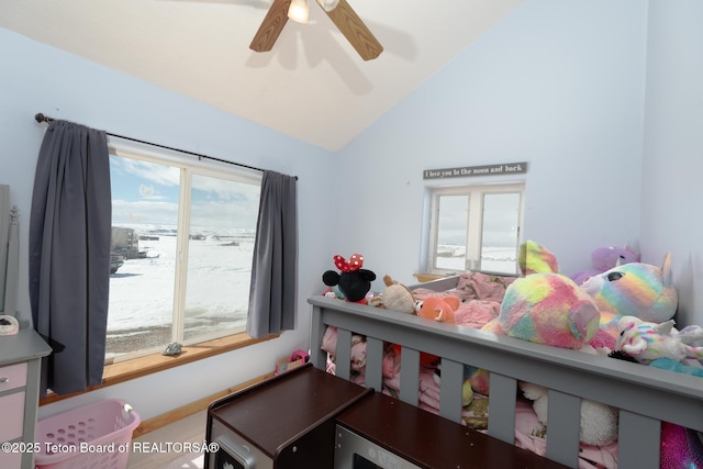 bedroom with vaulted ceiling and a ceiling fan