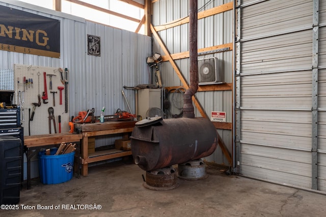 garage with metal wall and a workshop area