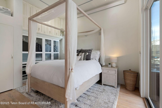 bedroom featuring wood finished floors