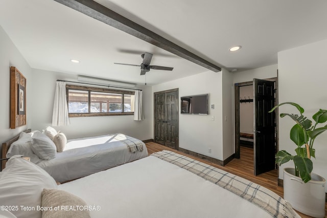 bedroom with beam ceiling, recessed lighting, ceiling fan, wood finished floors, and baseboards