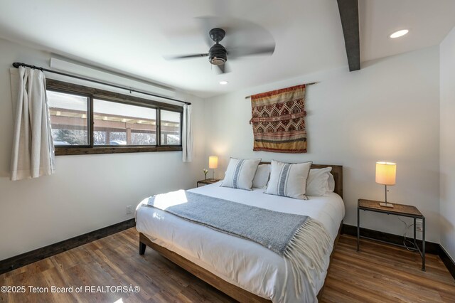 bedroom featuring recessed lighting, wood finished floors, beam ceiling, and baseboards