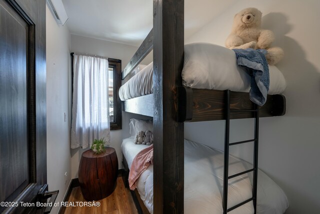 bedroom featuring wood finished floors