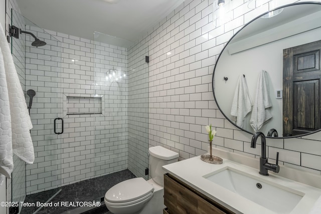 bathroom with a stall shower, decorative backsplash, toilet, vanity, and tile walls