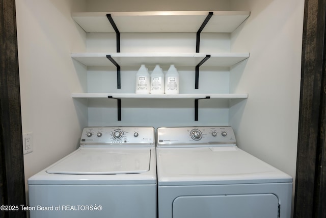 clothes washing area featuring laundry area and washing machine and dryer