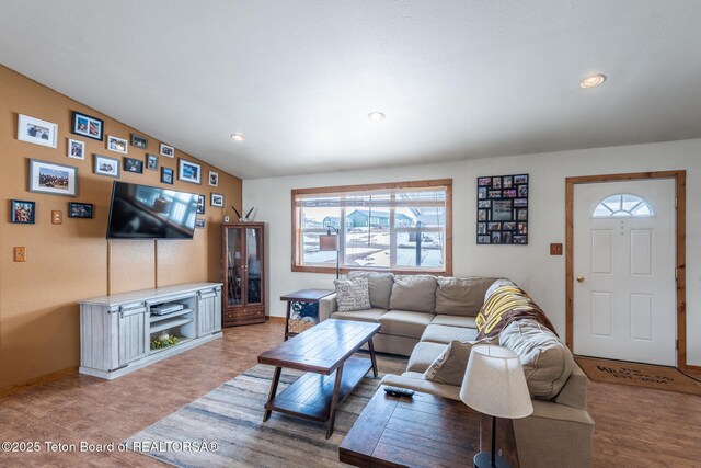 living room with wood finished floors and recessed lighting