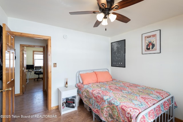 bedroom with baseboards, a ceiling fan, and wood finished floors