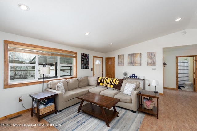 living room with vaulted ceiling, baseboards, wood finished floors, and recessed lighting