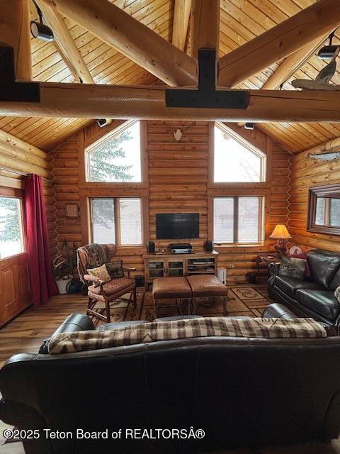 living room with high vaulted ceiling, wood ceiling, wood-type flooring, and beamed ceiling