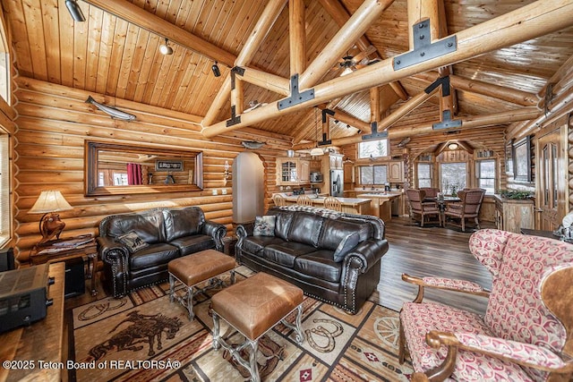 living area with log walls, high vaulted ceiling, hardwood / wood-style flooring, wooden ceiling, and beamed ceiling