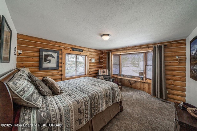 bedroom with a textured ceiling and carpet floors