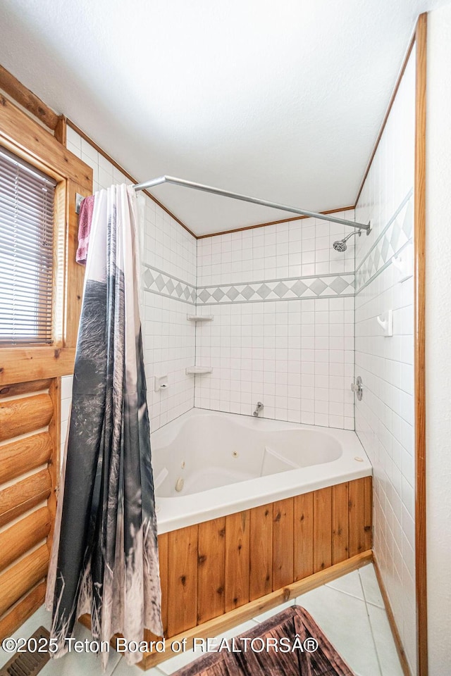 bathroom with tile patterned floors, log walls, tile walls, and shower / tub combo