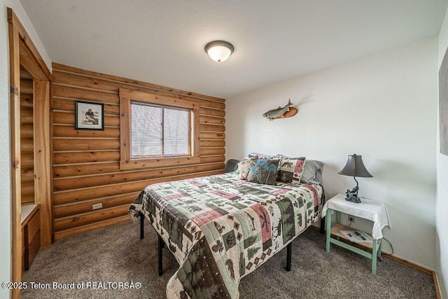 bedroom with carpet and baseboards