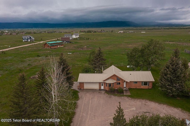 birds eye view of property with a rural view