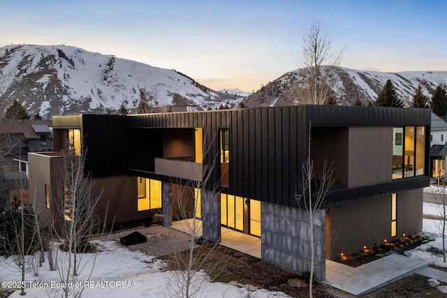 contemporary house featuring a mountain view