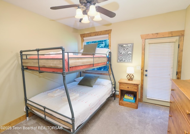 bedroom with baseboards, a ceiling fan, and carpet flooring