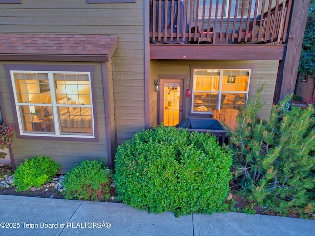 entrance to property with a balcony