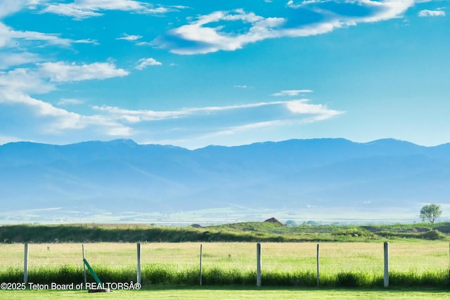 view of mountain feature with a rural view