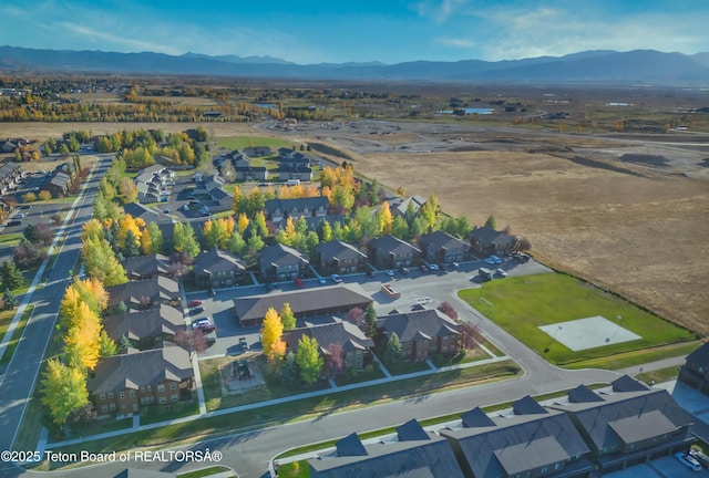 birds eye view of property with a mountain view and a residential view