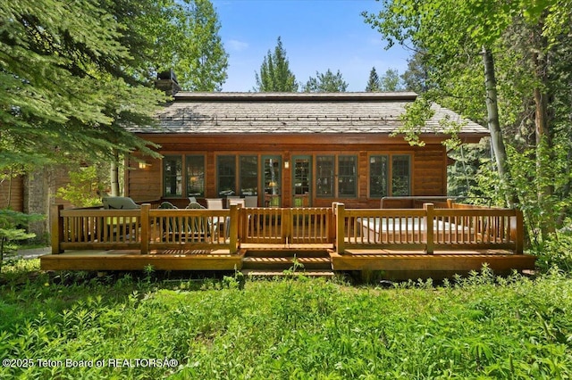 3102 W Arrowhead Rd, Teton Village, WY 83025 - rear view of house with a wooden deck