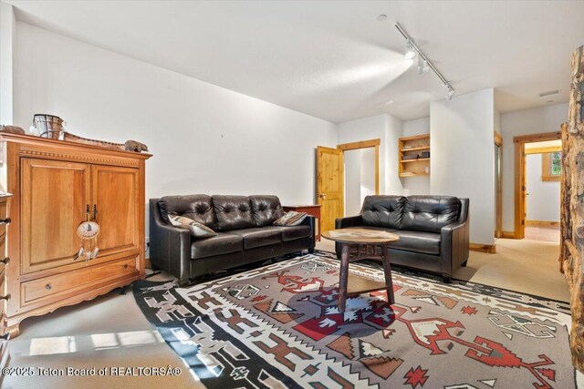 3102 W Arrowhead Rd, Teton Village, WY 83025 - living room featuring track lighting and light colored carpet