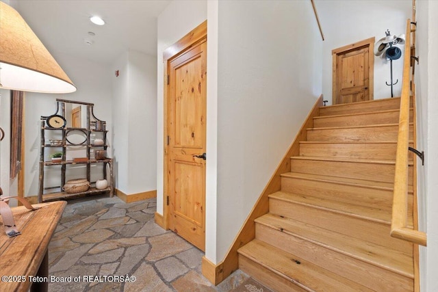 3102 W Arrowhead Rd, Teton Village, WY 83025 - stairway featuring baseboards and recessed lighting