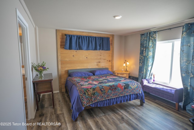 bedroom featuring wood finished floors