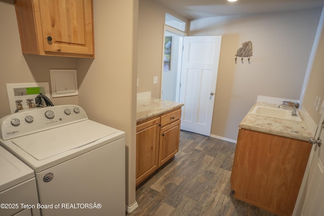 laundry room with a sink, cabinet space, separate washer and dryer, and dark wood-style floors