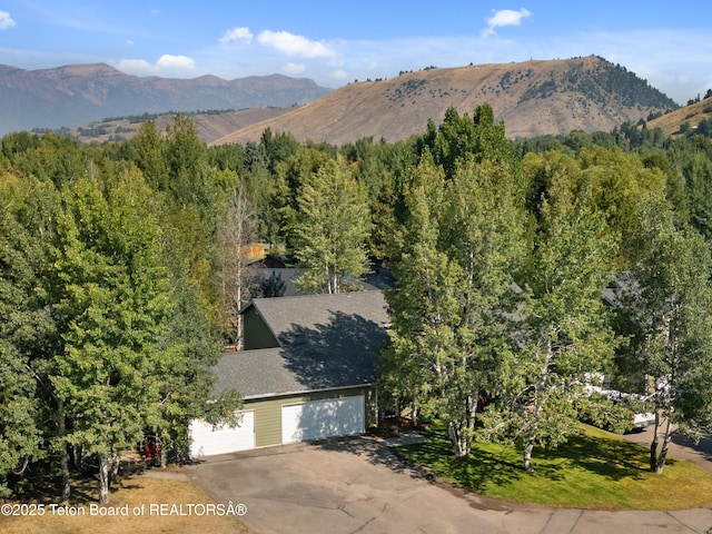 property view of mountains featuring a view of trees