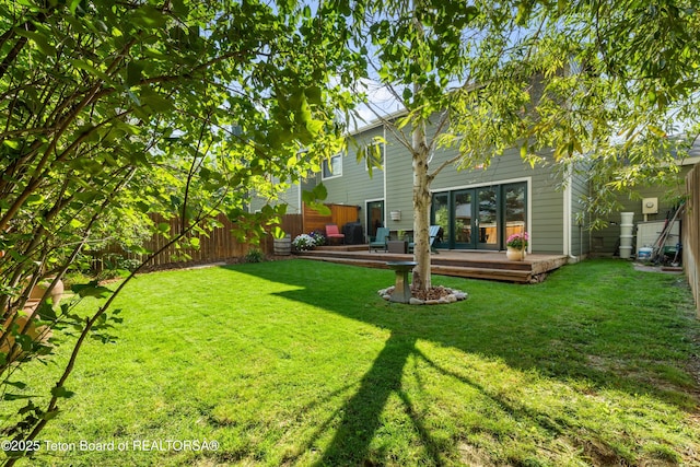 view of yard featuring a deck and a fenced backyard