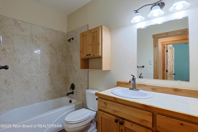 bathroom with vanity, toilet, and shower / bath combination