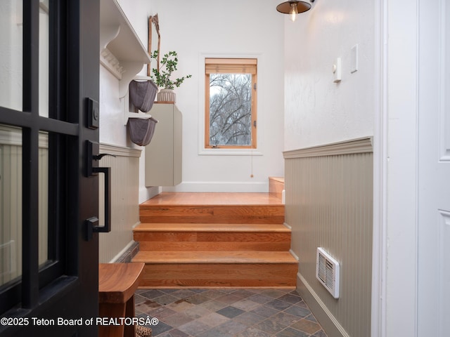 interior space with stone finish floor and visible vents