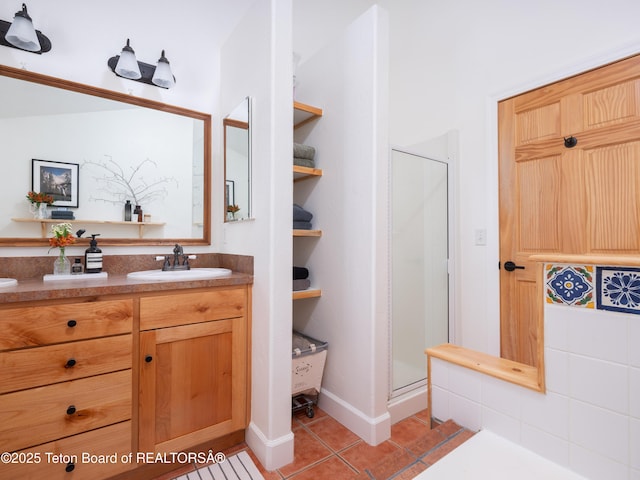 full bathroom with tile patterned floors, a shower stall, and vanity