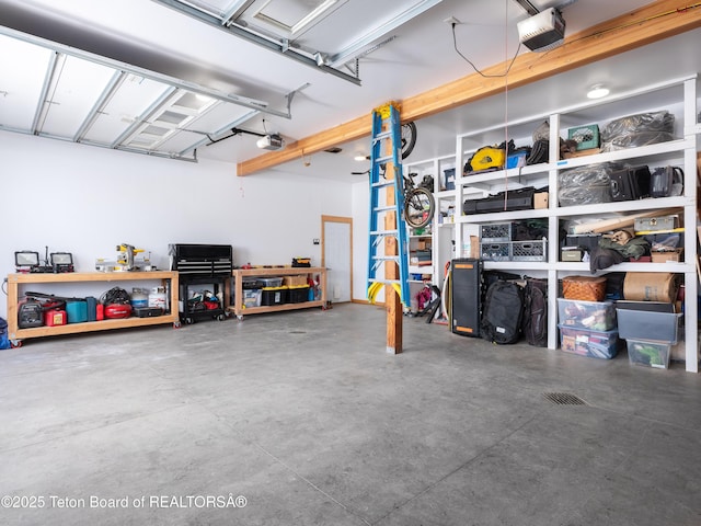 garage featuring a garage door opener