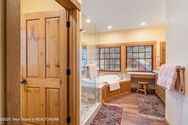 25640 Buffalo Run, Moran, WY 83013 - full bath with a bath, wood finished floors, a stall shower, and recessed lighting