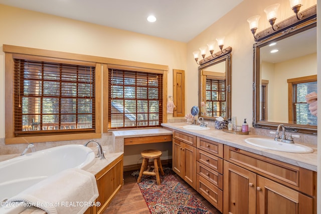 25640 Buffalo Run, Moran, WY 83013 - full bathroom featuring double vanity, a bath, wood finished floors, and recessed lighting