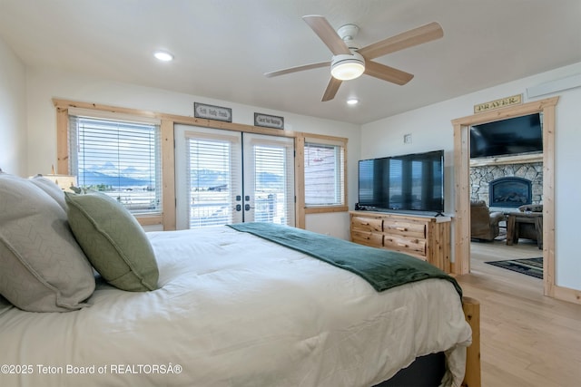 4535 Roxanne St, Tetonia, ID 83452 - bedroom featuring french doors, access to exterior, light wood-style floors, a ceiling fan, and recessed lighting