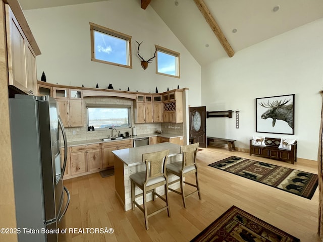 4535 Roxanne St, Tetonia, ID 83452 - kitchen with stainless steel appliances, high vaulted ceiling, a sink, light countertops, and beamed ceiling