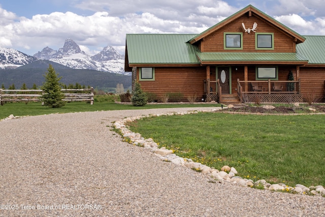 4535 Roxanne St, Tetonia, ID 83452 - view of front of home featuring covered porch, gravel driveway, metal roof, and a mountain view