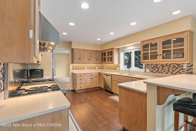 kitchen featuring dishwasher, extractor fan, light brown cabinets, and light countertops