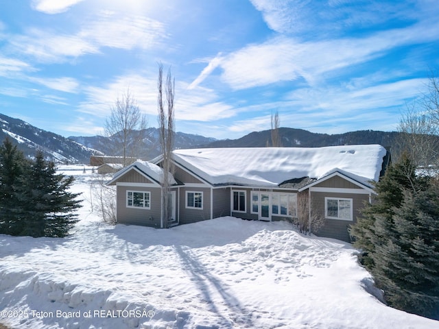 view of snow covered house