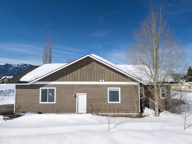 view of snow covered house