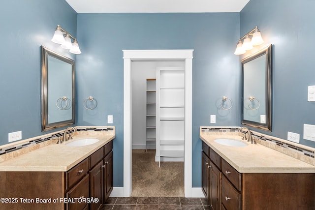 full bath with tasteful backsplash, two vanities, and a sink