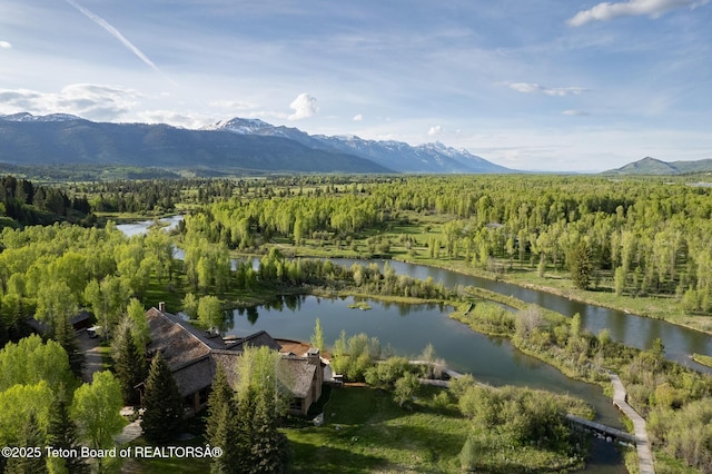 1525 S Thunder Rd, Wilson, WY 83014 - drone / aerial view of a water and mountain view and a heavily wooded area