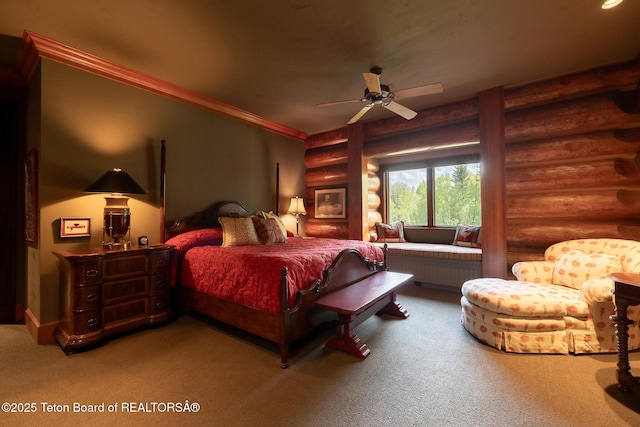 1525 S Thunder Rd, Wilson, WY 83014 - bedroom featuring log walls, carpet flooring, and ceiling fan