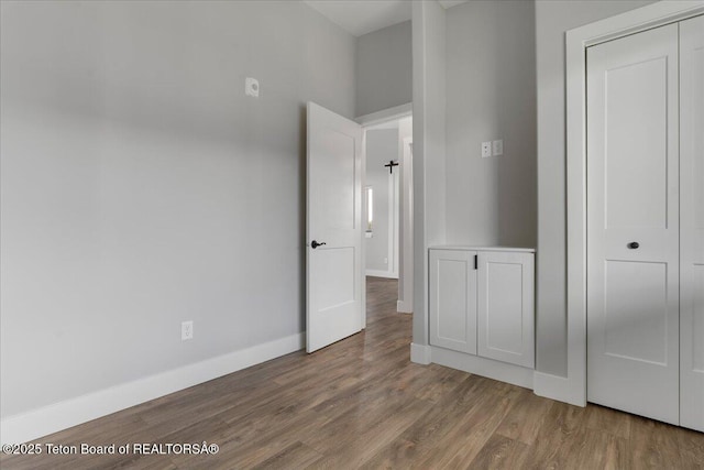 138 Larkspur Ave Unit 402, Victor, ID 83455 - unfurnished bedroom with wood finished floors and a closet