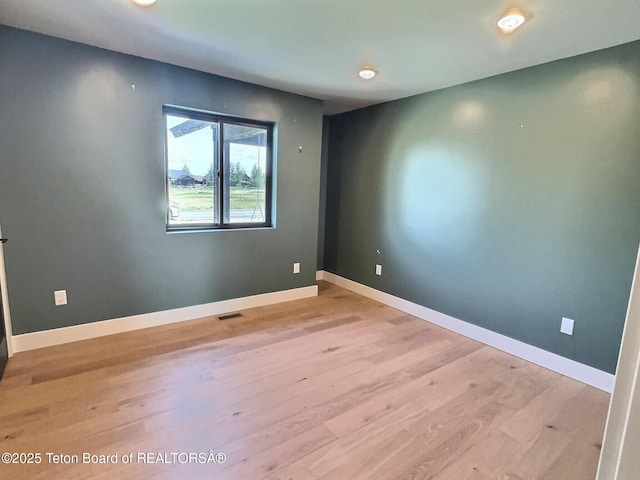 1714 River Meadows Dr, Victor, ID 83455 - empty room featuring wood finished floors and recessed lighting