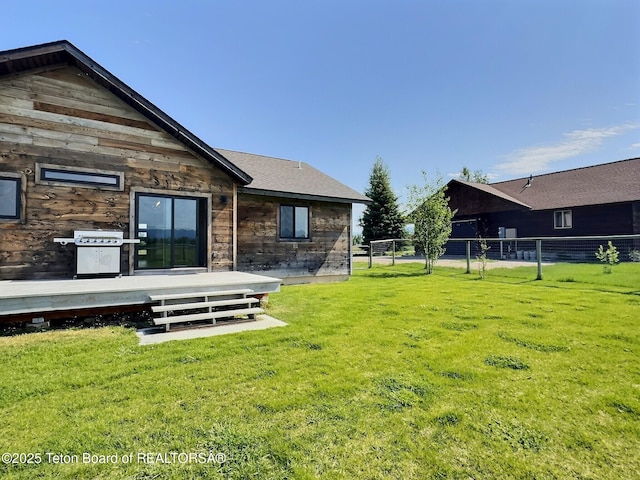 1714 River Meadows Dr, Victor, ID 83455 - view of green lawn featuring a wooden deck